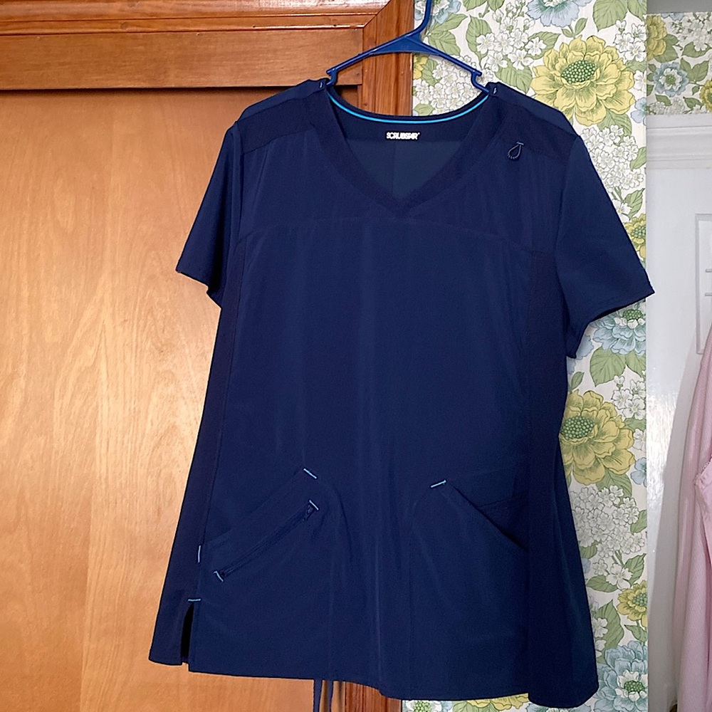 2 scrub sets, Royal Blue & Navy XL tops and pants. 1 Navy top 2XL